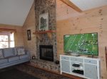 Living area has a 55 inch Flat Screen TV with Gas Fireplace